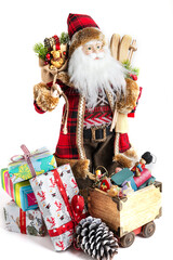 Santa Claus with skis and gifts in a bag on a white background.