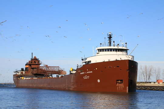 Great Lakes Iron Ore freighter. The nautical ship brings mined ore from Minnesota to the local Steel mill. The Herbert Jackson was built in 1958. Cleveland, Ohio, USA &ndash; July 10