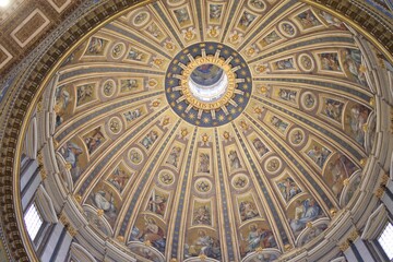 Mesmerizing shot of the interior of the dome ceiling with fresco paintings in Vatican city