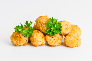 Fast homemade food at home. Breaded chicken nuggets.Breaded Chicken Inner Fillet with green lettuce leaves on a White Background.Chicken Breaded Raw Meat,Fillet.Chicken breaded schnitzels.Fast cooking