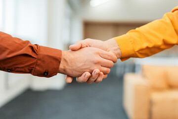 Closeup hands of successful business people handshake on meeting, successful deal, selective focus....