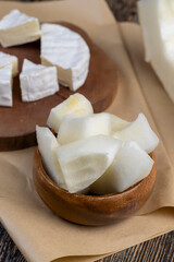 soft processed cheese on a board and paper