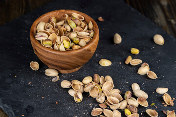 a large number of salty and crispy pistachios close-up