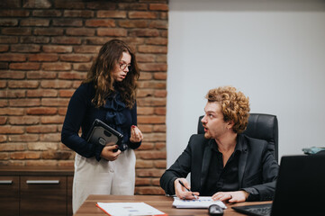 Collaborating on Market Trends and Financial Planning in a Corporate Office Setting