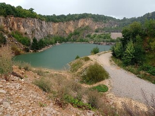 Fototapeta na wymiar Flooded limestone quarry