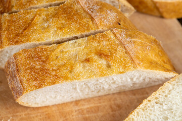 wheat loaf of bread close-up on the table