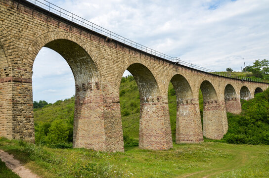 Ancient stone viaduct railway bridge built in the time of Austro-Hungarian Empire in Western Ukraine in Ternopil region in the village of Plebanivka