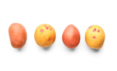 Fresh raw potatoes on white background