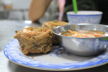Banh Cong-  Viet Nam crunchy fried shrimp cake that served with lettuce, assorted fresh herbs and sweet/sour dipping sauce