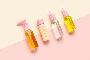 Set of different travel cosmetic products on color background