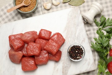 Raw beef meat and different ingredients for cooking delicious goulash on table, flat lay