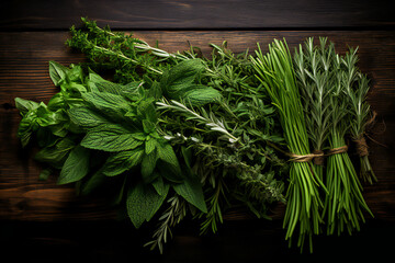 bunch of fresh green herbs. Melissa, rosemary and mint in rustic setting, wooden background. Top view, flat lay.  - obrazy, fototapety, plakaty