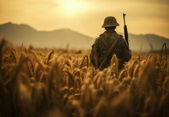 Soldier with his back in a wheat field, sunset in the background. Generative AI