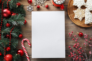 Flat lay composition with blank paper sheet and Christmas decor on wooden table, space for text. Letter for Santa - obrazy, fototapety, plakaty