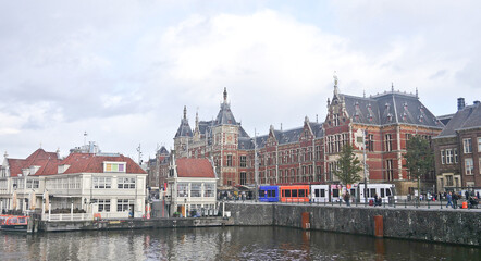 Naklejka na ściany i meble Netherland historical and modern buildings along the Amsterdam river canal 