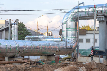 Temporary bypass of city central heating pipeline. Two large diameter metal pipes with thermal...