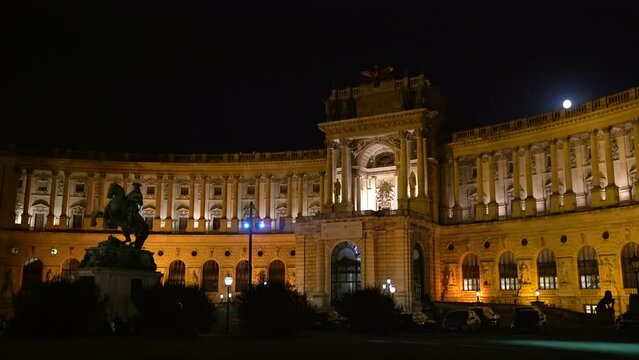 Vienna, Austria &ndash; September 27, 2023 Hofburg Imperial Palace Night Vienna 4K UHD. Moonrise over the Hofburg Imperial Palace in Vienna illuminated at Night. Vienna, Austria. 4K, UHD.
