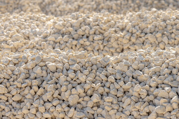 Crushed stone piles, a selected focus. Crushed stones for road repair. Hills of crushed stone in...