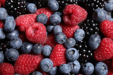 Assortment of fresh ripe berries as background, top view