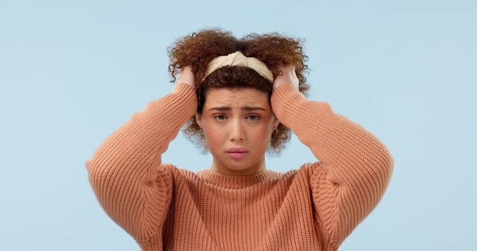 Anxiety, thinking and face of sad woman in studio with stress, mistake or disaster on blue background. Fail, portrait and lady model with mental health crisis, worry or risk, doubt or confused emoji