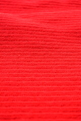 Fototapeta premium texture of red wool knitted yarn, woolen fabric background