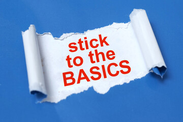 Stick to basics, text written on paper, life and business metaphor