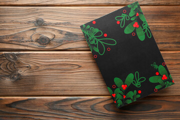 Blank Christmas invitation card on wooden table, top view. Space for text