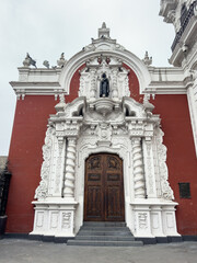Fototapeta na wymiar Ancient Side Door of The San Marcelo Church (Iglesia de San Marcelo), built in 1551 at Lima, Peru.