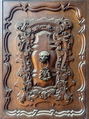 Antique wooden door of The San Marcelo Church (Iglesia de San Marcelo), built in 1551 at Lima, Peru.