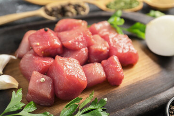 Cooking delicious goulash. Raw beef meat on board, closeup