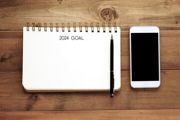 2024 goals on blank notebook paper on white background, 2024 new year mock up, template, flat lay
