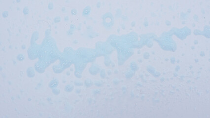 blue soap foam texture on white background