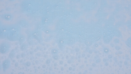 Obraz premium blue soap foam texture on white background
