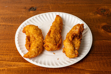 Fried chicken tenders on a plate