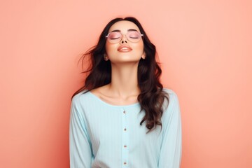 Obraz premium Woman Embracing Stillness in Front of Vibrant Pink Wall Generative AI