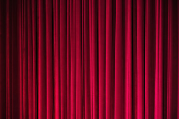 Stage red velvet curtain under spotlight background.