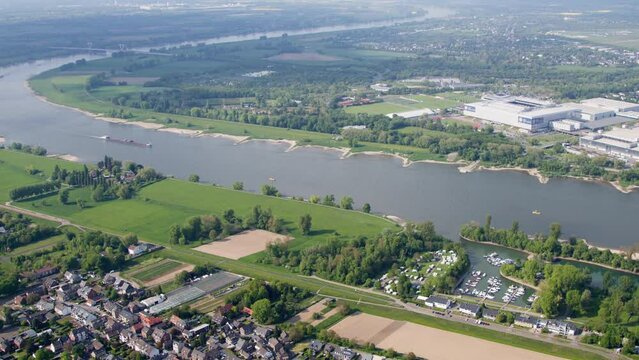 High resolution video from the Messe Duesseldorf, taken from a helicopter. It shows the exhibition including in front of the rhine. In the background is the Airport Duesseldorf.