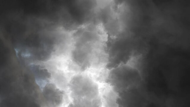 a thunderstorm on a gray dark cloudy sky 4k