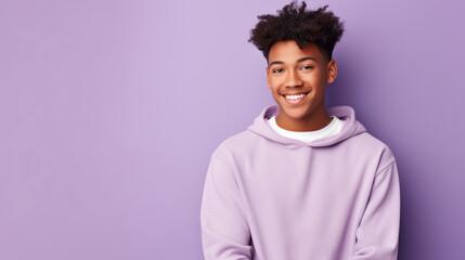 Happy, teen boy and portrait of a student smiling, high school and education concept with copy-space. Confident, African American male posing against a purple background in studio - obrazy, fototapety, plakaty
