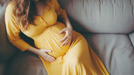 Pregnant, woman and mother touching or caressing her belly while relaxing at home. Expecting, mom to be and cropped of a female rubbing her stomach and preparing for motherhood and childbirth - obrazy, fototapety, plakaty