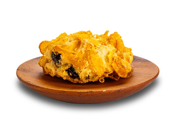 Single delicious homemade crispy corn flakes cooky in wooden plate isolated on white background with clipping path.