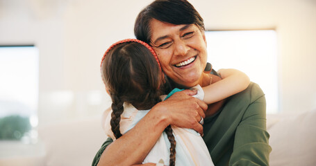 Child, grandmother and hug for happy smile bonding, relax connection in retirement. Young girl, old woman and embrace for holiday rest or together in lounge for funny joke, love trust or care safety