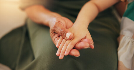 Child, old woman and holding hands closeup for safety care or together bonding, protection or...