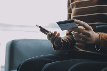 Close up of woman hand using credit card and laptop for payment and online shopping, Online shopping, payments digital banking, E-commerce concept.