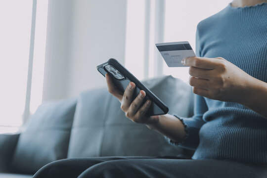 Close up of woman hand using credit card and laptop for payment and online shopping, Online shopping, payments digital banking, E-commerce concept.