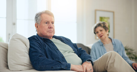 Senior, couple or stress with conflict and fight on sofa in living room of home with anger and...