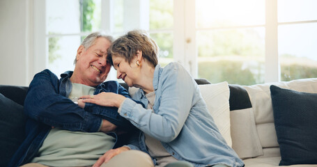 Love, home and mature couple laughing at funny conversation, retirement joke and smile on living...