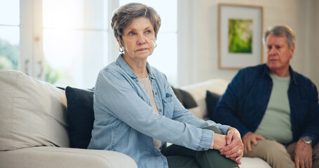 Senior, couple or angry with conflict and fight on sofa in living room of home with anger and...