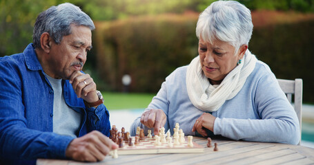Senior couple, chess match or thinking of strategy, plan or mindset for brain power or move at home. Elderly woman, old man or board game for problem solving, ideas or challenge to relax in backyard