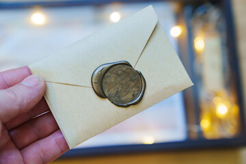A small envelope with wax seal. 